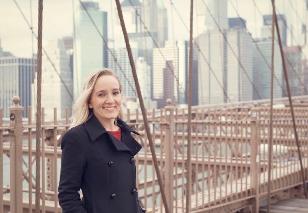 Victoria standing on the Brooklyn Bridge in NYC